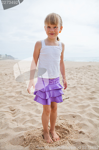 Image of Young smiling girl at beach