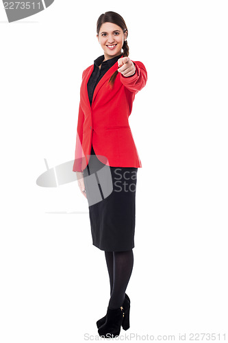 Image of Elegant presentable businesswoman pointing