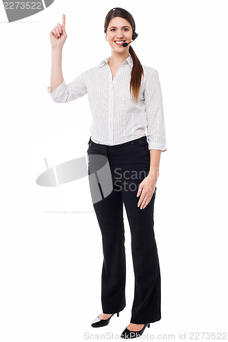 Image of Customer support executive pointing upwards