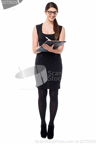 Image of Pretty secretary taking down notes