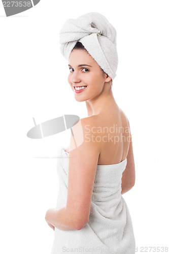 Image of Spa woman turning back and smiling