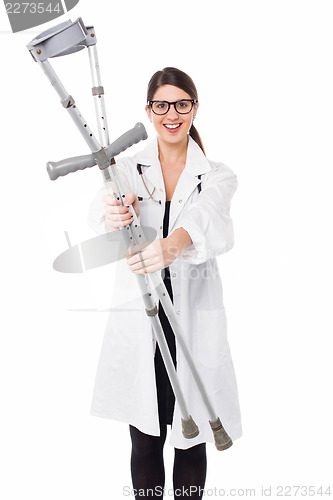Image of Female doctor displaying a set of crutches