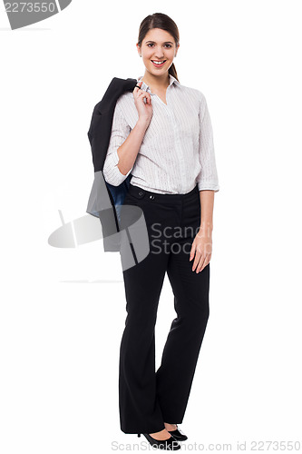 Image of Corporate lady with blazer slung over her shoulder