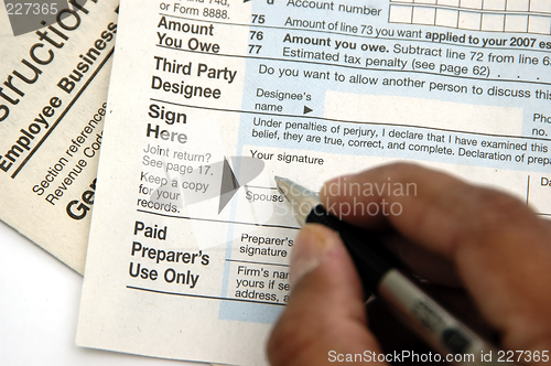 Image of Signing a tax return