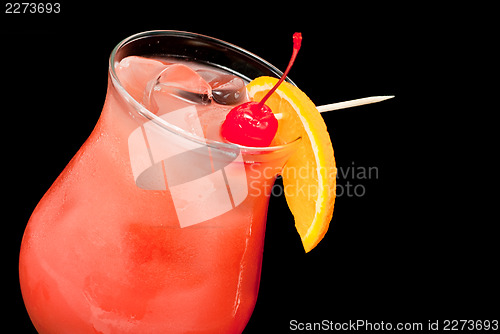 Image of cocktail with red cherry and orange closeup