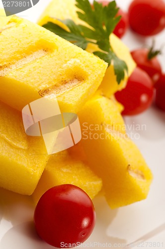 Image of Polenta taragna with sauce and tomatoes