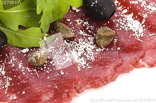 Image of Beef carpaccio with rucola and parmesan 