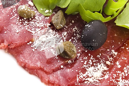 Image of Beef carpaccio with rucola and parmesan 