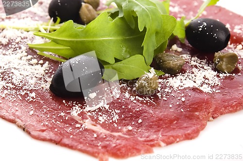 Image of Beef carpaccio with rucola and parmesan 