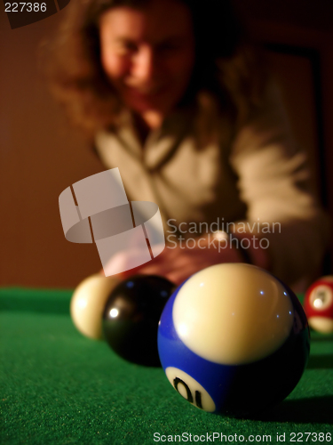 Image of Happy woman playing pool # 01