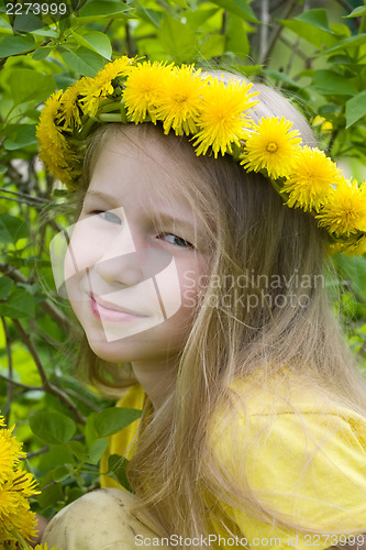 Image of smiling girl in dandelion wreath