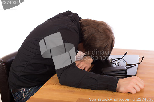 Image of Business man sleep on his laptop