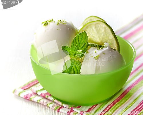 Image of bowl of fresh lime sorbet decorated with lime and mint