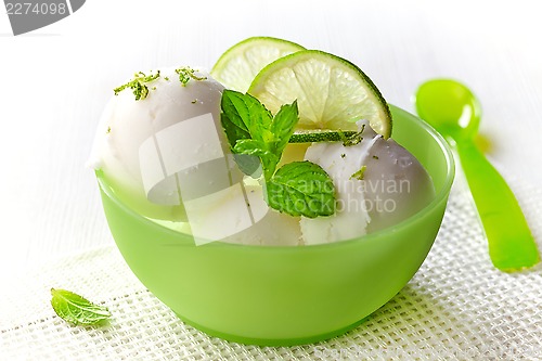 Image of bowl of fresh lime sorbet decorated with lime and mint