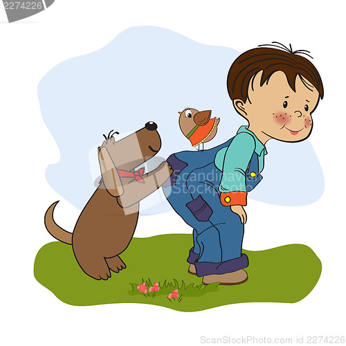 Image of little boy playing with his dog