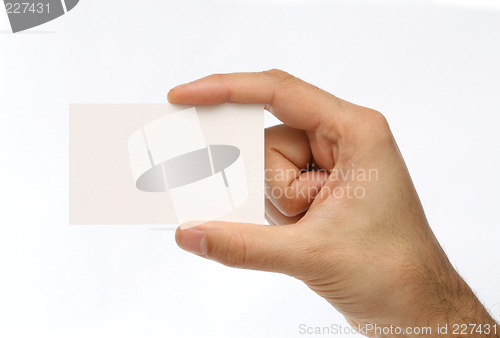 Image of Man holding a business card