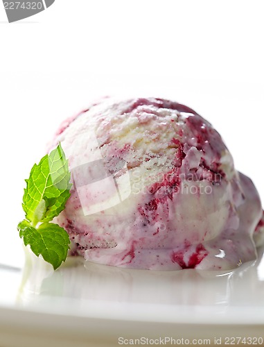 Image of scoop of fruit ice cream on white plate