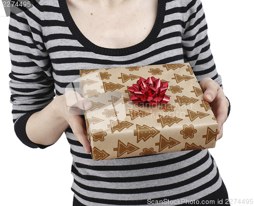 Image of Young woman holding a present