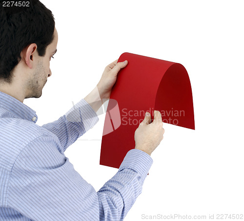 Image of Man holding a paper