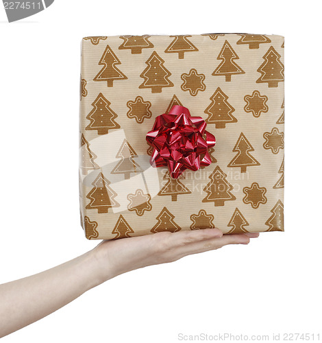 Image of Young woman holding a present