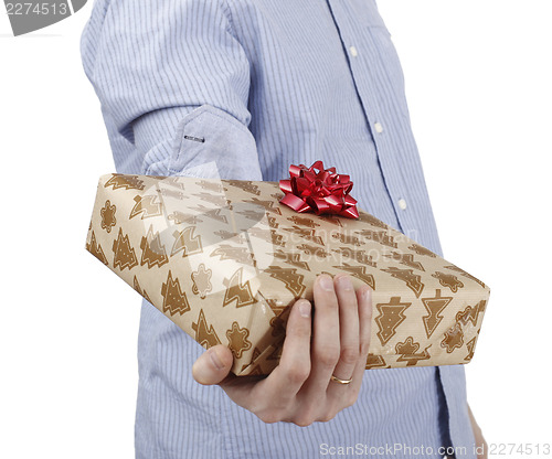 Image of Young man holding a present