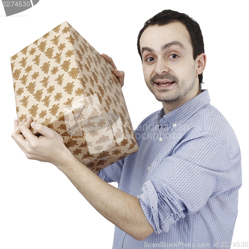 Image of Young man holding a present