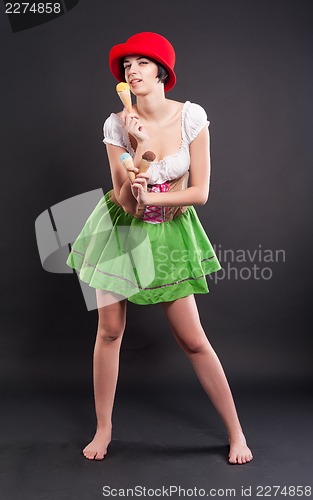 Image of Pretty girl in german style with ice cream