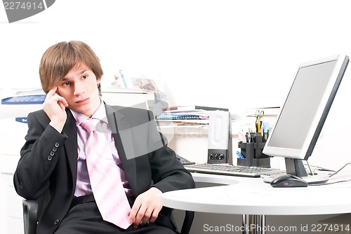 Image of young businessman in office