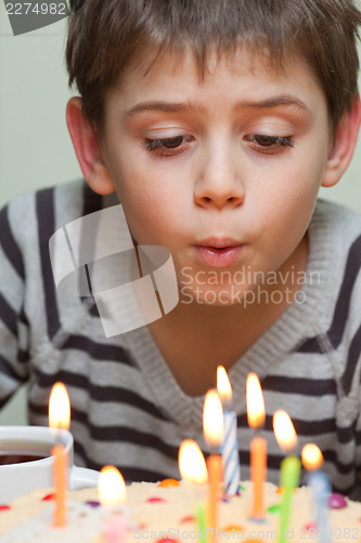 Image of Cute boy at birthday cake