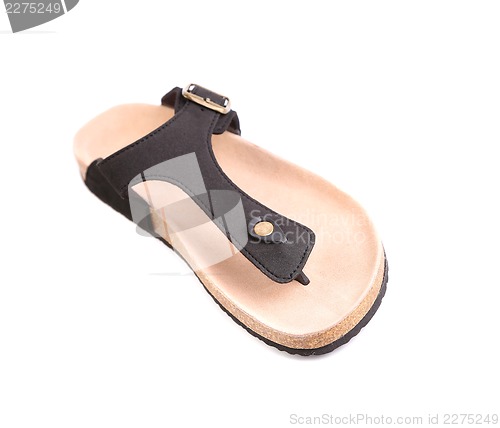 Image of One of the pair of striped flip-flop sandals isolated on white