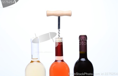 Image of A set of three kinds of wine and corkscrew