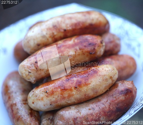 Image of Pork sausages barbecued on the plate