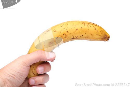 Image of A stale banana in a hand