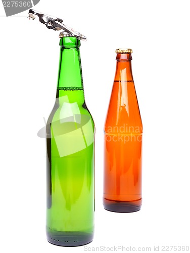 Image of Two bottles of beer and a opener