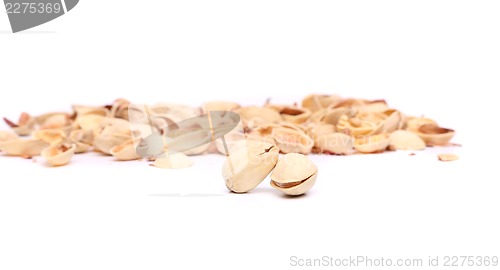 Image of Two pistachios and peel.