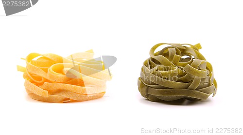 Image of Tagliatelle paglia e fieno homemade tipycal italian pasta close-up.