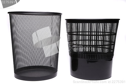 Image of Metal and plastic trash cans on white background
