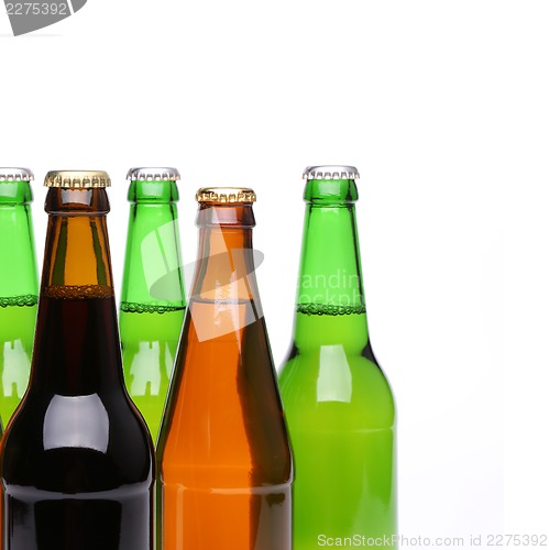 Image of Closed bottles of beer on a white background