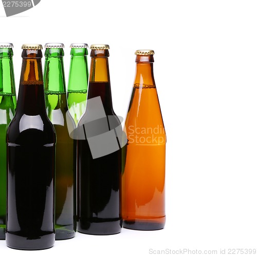 Image of Closed bottles of beer on a white background