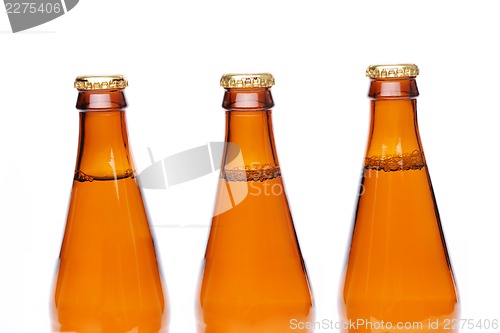 Image of Three brown neck bottles