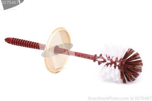 Image of A toilet brush lies horizontally