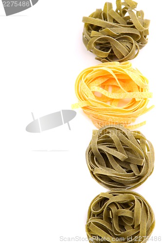 Image of Tagliatelle paglia e fieno homemade tipycal italian pasta close-up.