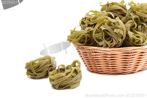 Image of Tagliatelle paglia e fieno at round woven straw basket