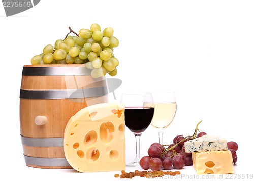 Image of barrel, cheeses, glasses of wine and ripe grapes