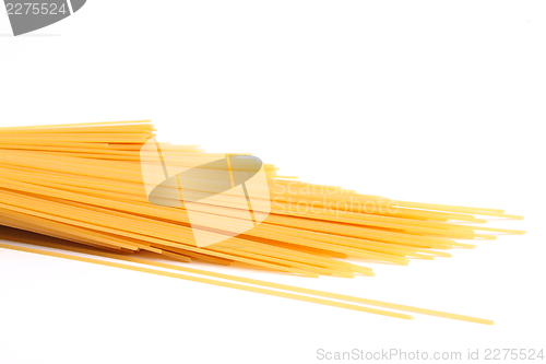 Image of uncooked spaghetti close-up on a white background