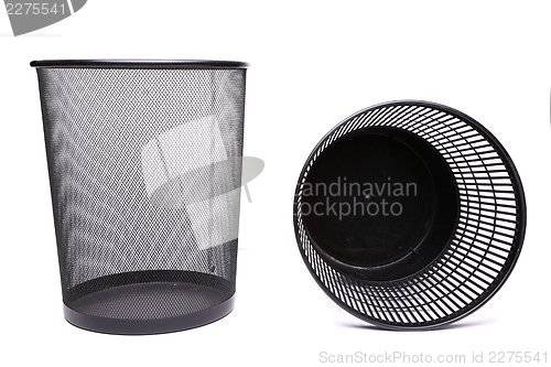 Image of A metal trash can and a top plastic trash can