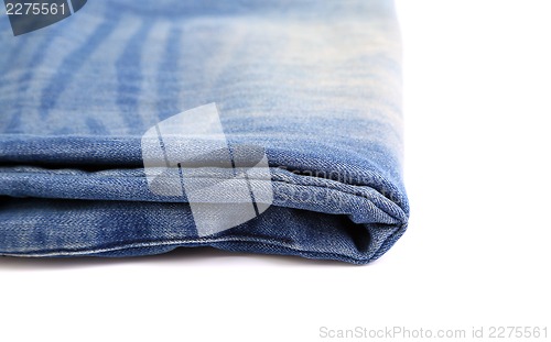 Image of Blue jeans folded isolated on white