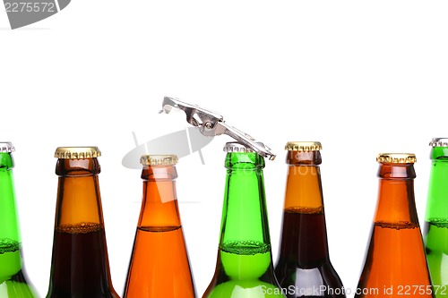 Image of Top bottles of beer and a opener