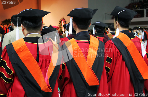 Image of Three Asian university graduates