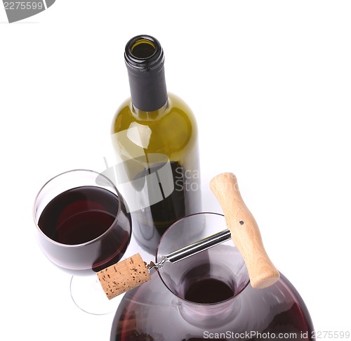 Image of decanter, bottle and glass with red wine top view